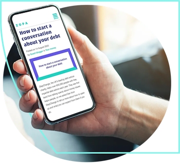 Hand holding a phone that is showing the zopa blog