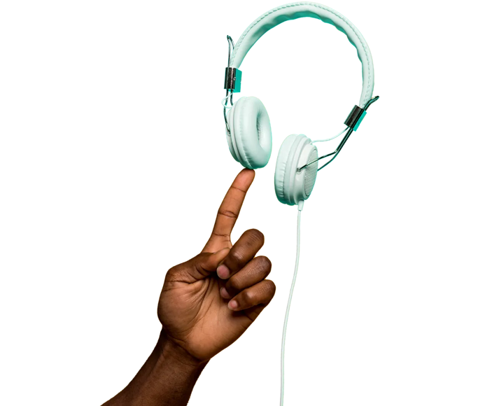 Hand pointing at some headphones