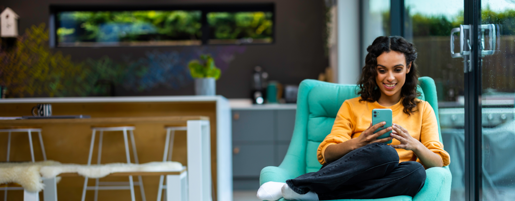 woman on teal chair woman on teal chair
