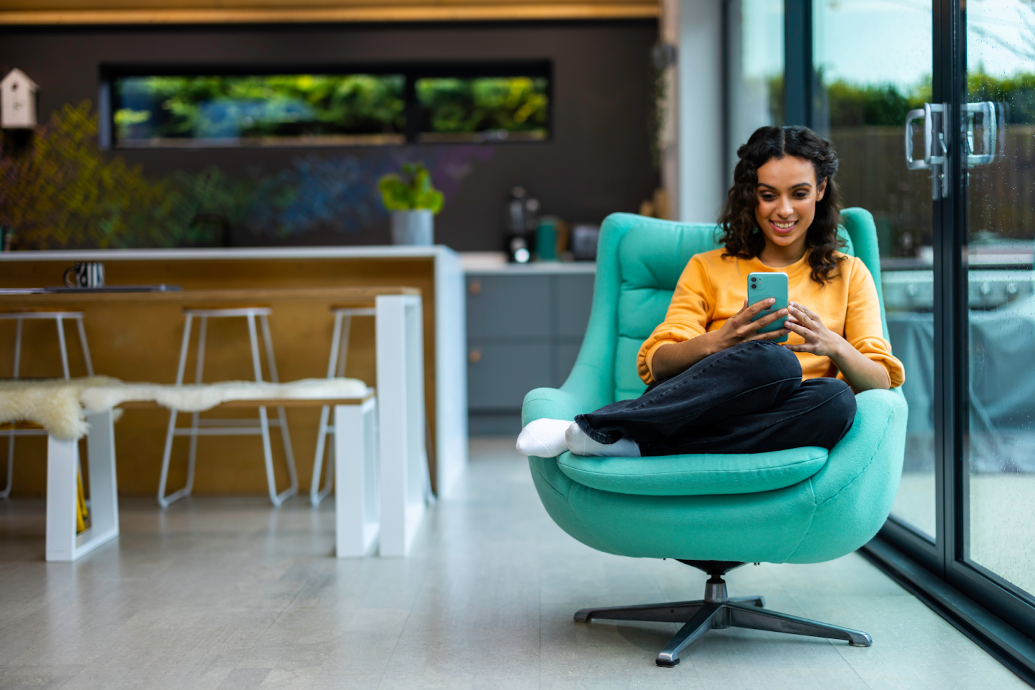 woman on teal chair