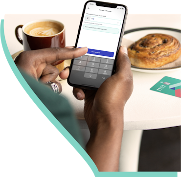 Image of someone using Zopa app over breakfast