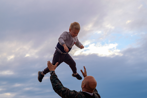 Father and son playing