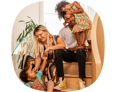 family sat on staircase