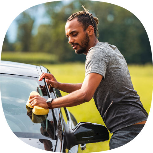 man washing car