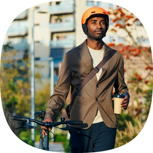 man walking his bike