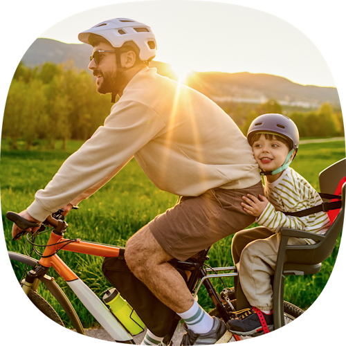 Man and child riding bike