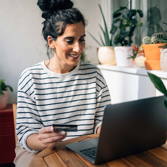 woman paying something on computer