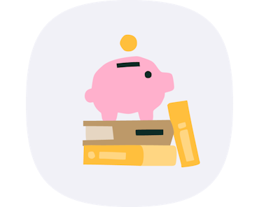 Piggy bank sitting on a pile of books.