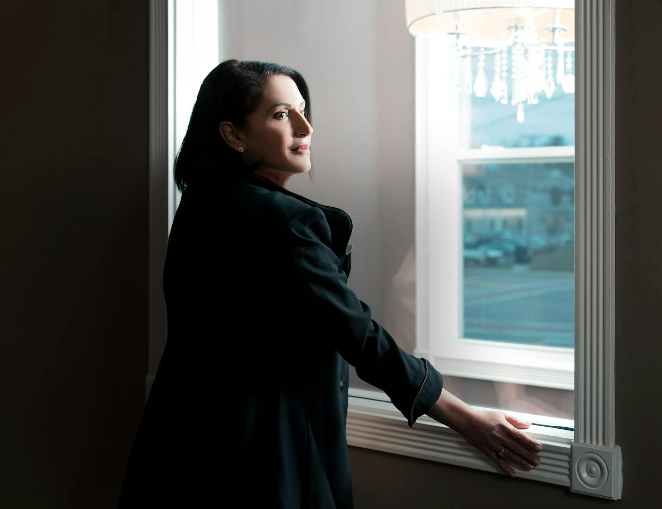 Woman in front of a window