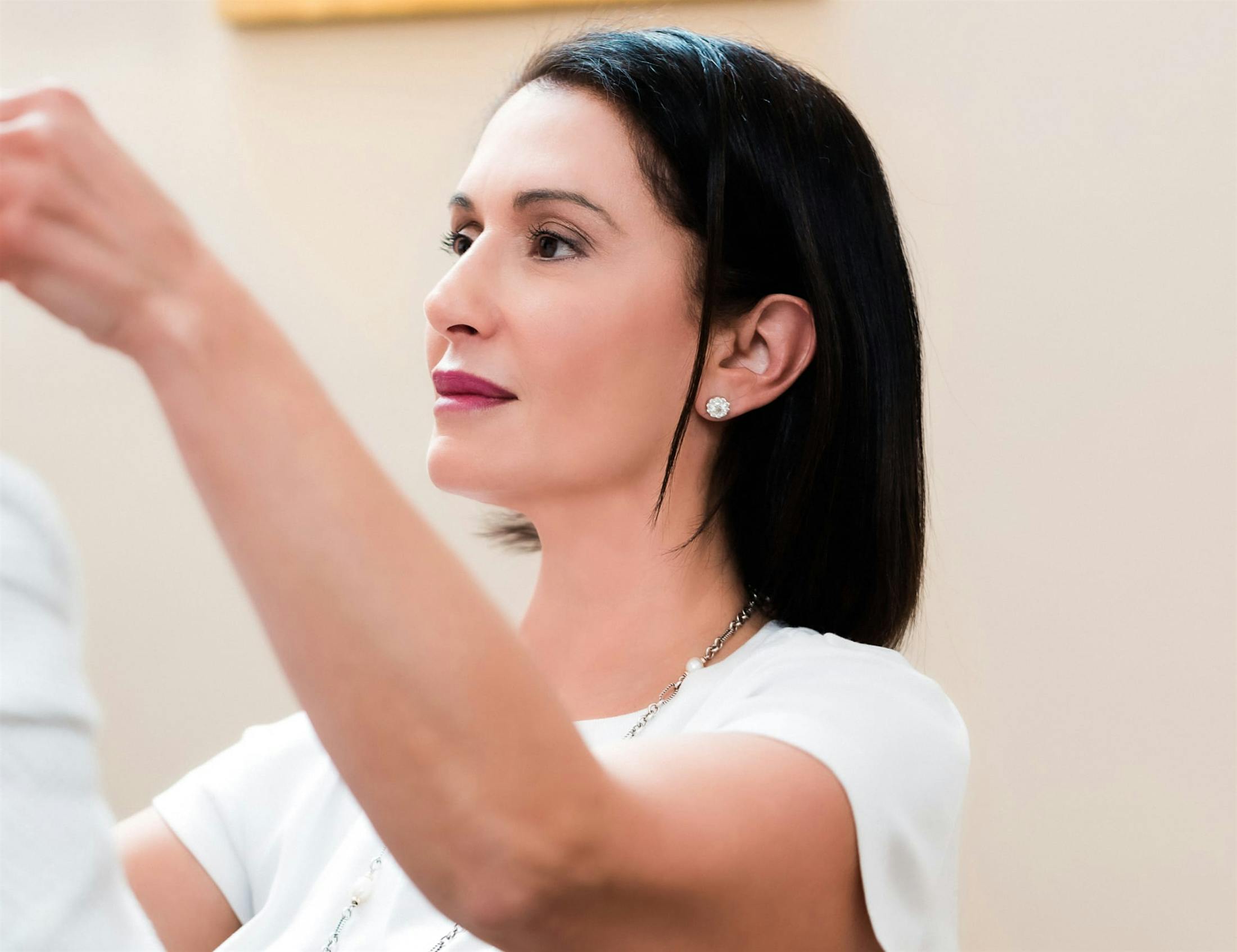 Dr. Poulos working with a patient