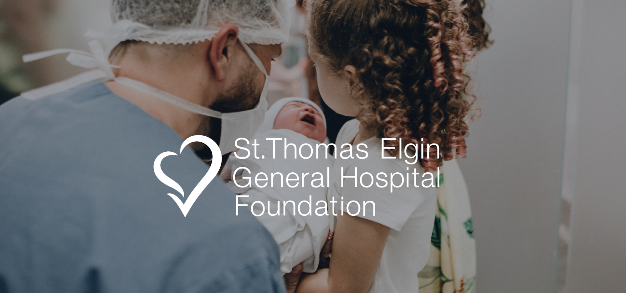 little girl and dad holding newborn baby in the hospital. St. Thomas Elgin General Hospital Foundation logo overlayed.