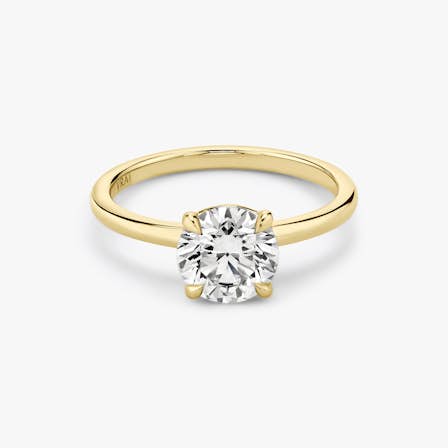 Yellow gold signature solitaire engagement ring with Round Brilliant cut diamond