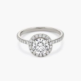 Signature halo round brilliant platinum engagement ring