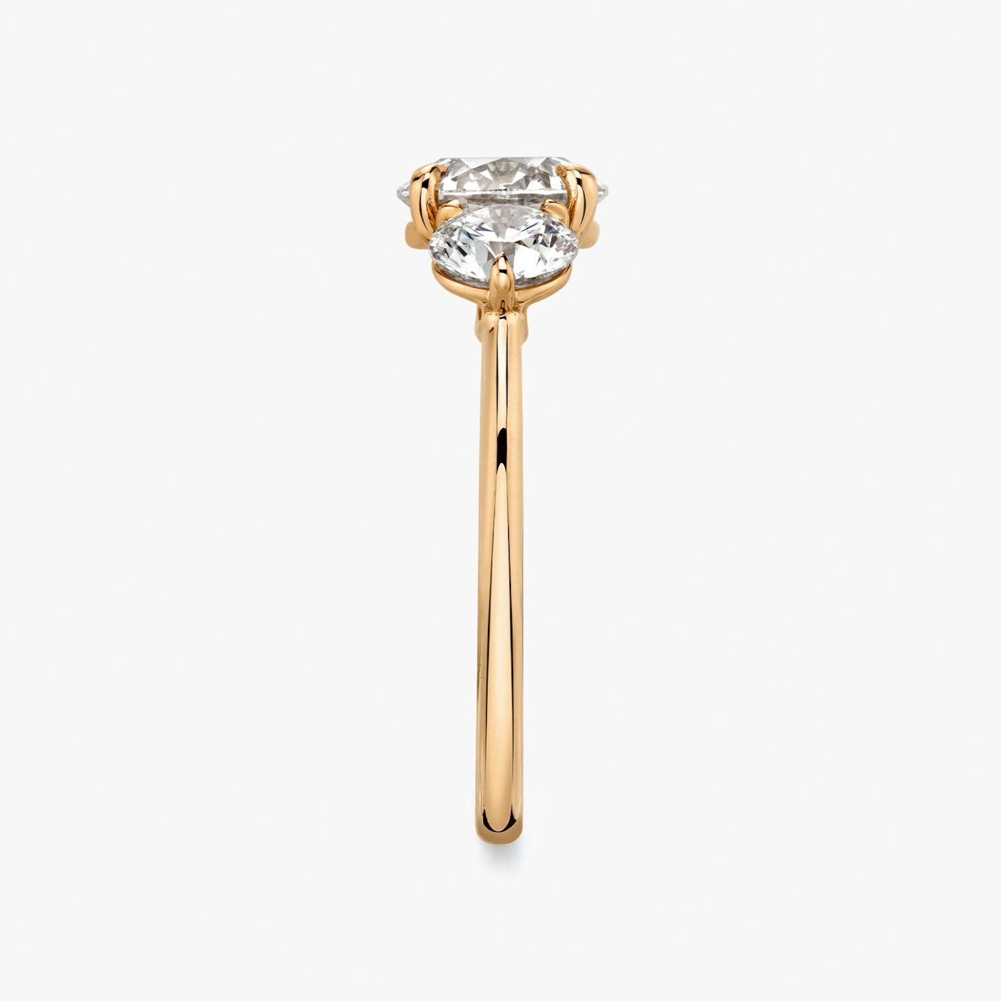 The Three Stone | Round Brilliant | 14k | 14k Rose Gold | Band: Plain | Carat weight: See full inventory | Side stone carat: 1/2 | Side stone shape: Round Brilliant | Diamond orientation: vertical