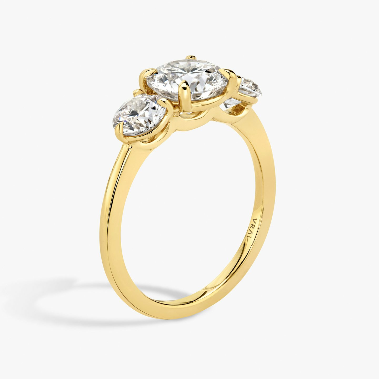 The Three Stone | Round Brilliant | 18k | 18k Yellow Gold | Band: Plain | Carat weight: See full inventory | Side stone carat: 1/2 | Side stone shape: Round Brilliant | Diamond orientation: vertical