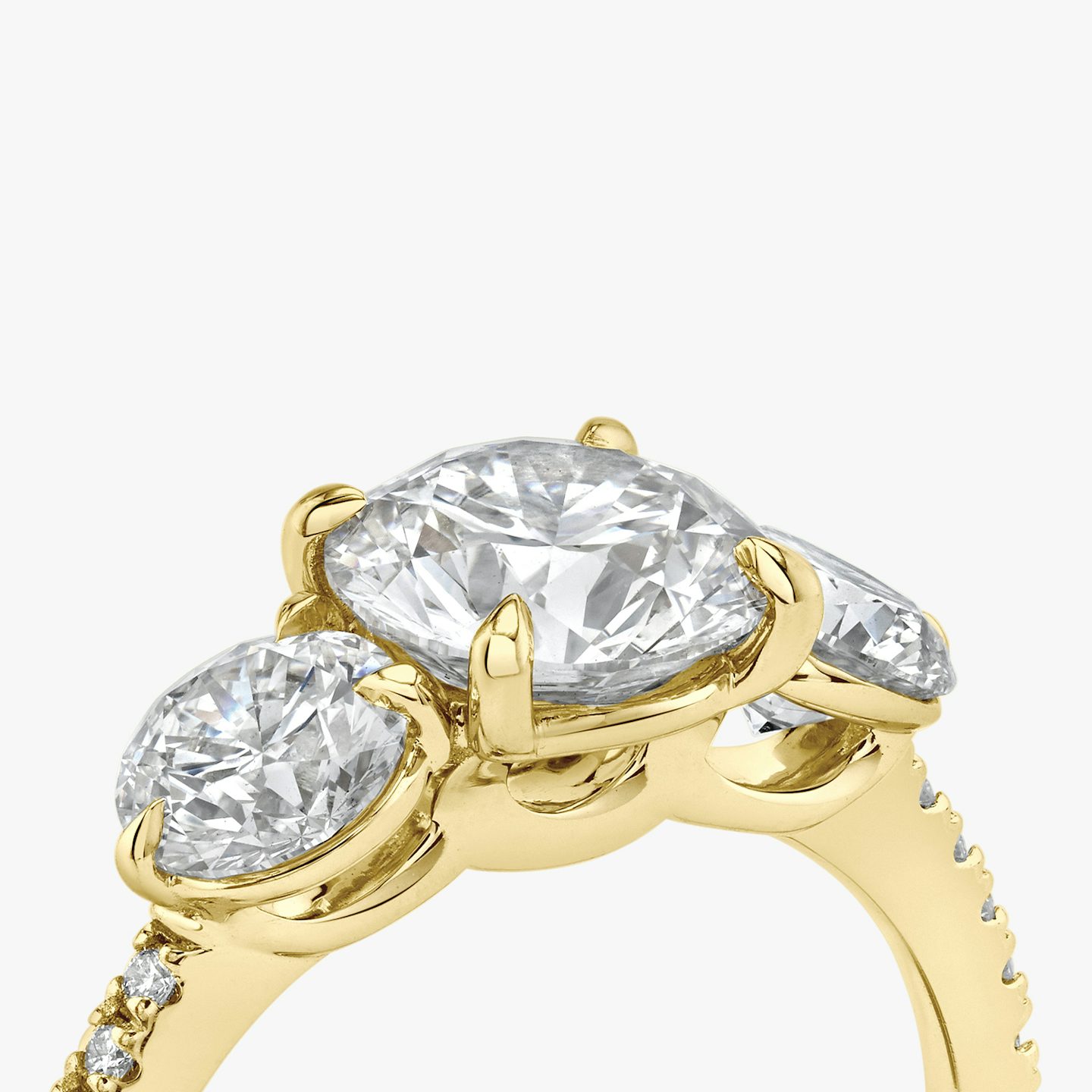 The Three Stone | Round Brilliant | 18k | 18k Yellow Gold | Band: Pavé | Carat weight: See full inventory | Side stone carat: 1/2 | Side stone shape: Round Brilliant | Diamond orientation: vertical