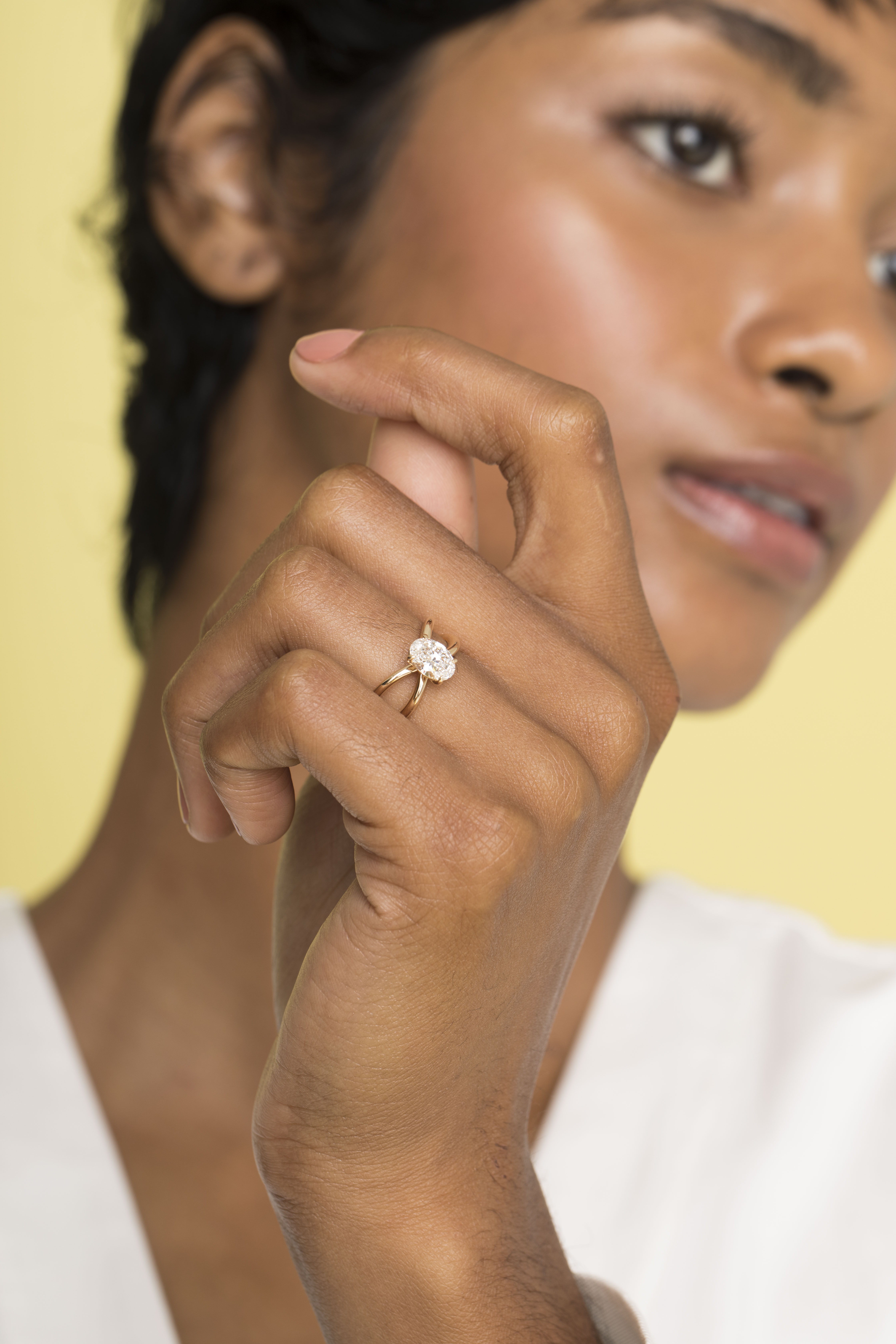 Oval engagement ring with twisted band deals