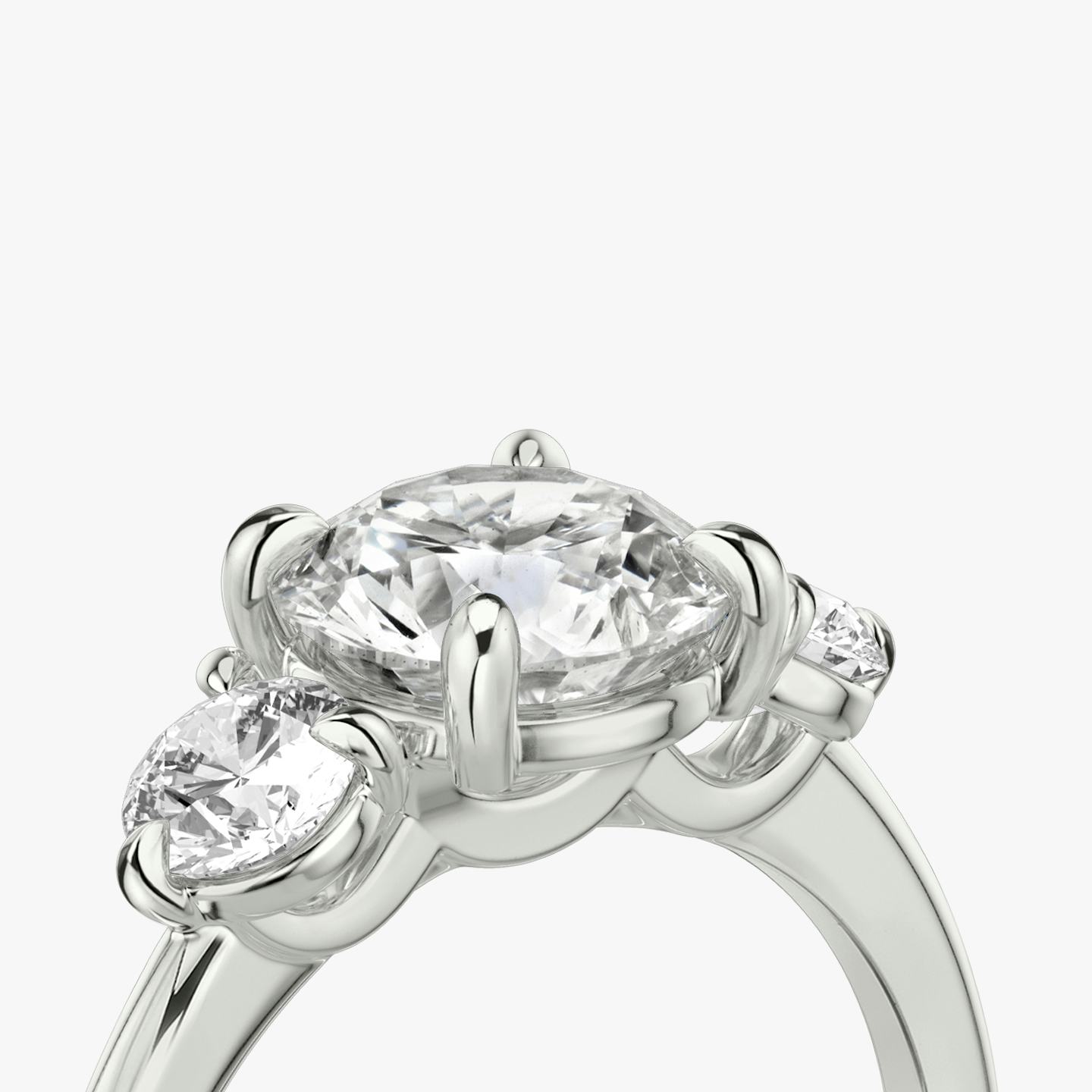 The Three Stone | Round Brilliant | 18k | 18k White Gold | Band: Plain | Carat weight: See full inventory | Side stone carat: 1/4 | Side stone shape: Round Brilliant | Diamond orientation: vertical