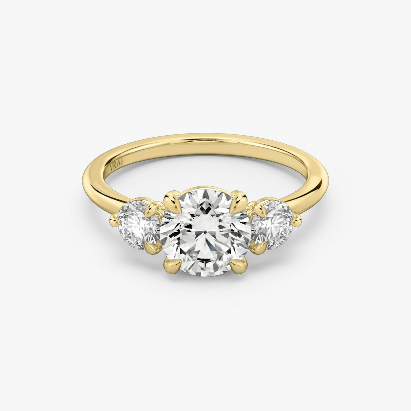 The Three Stone | Round Brilliant | 18k | 18k Yellow Gold | Band: Plain | Carat weight: See full inventory | Side stone carat: 1/4 | Side stone shape: Round Brilliant | Diamond orientation: vertical