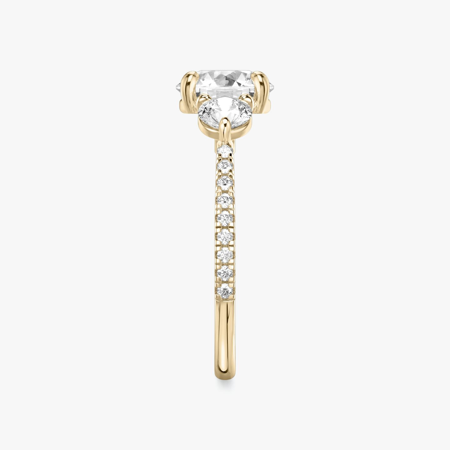 The Three Stone | Round Brilliant | 14k | 14k Rose Gold | Band: Pavé | Carat weight: See full inventory | Side stone carat: 1/4 | Side stone shape: Round Brilliant | Diamond orientation: vertical