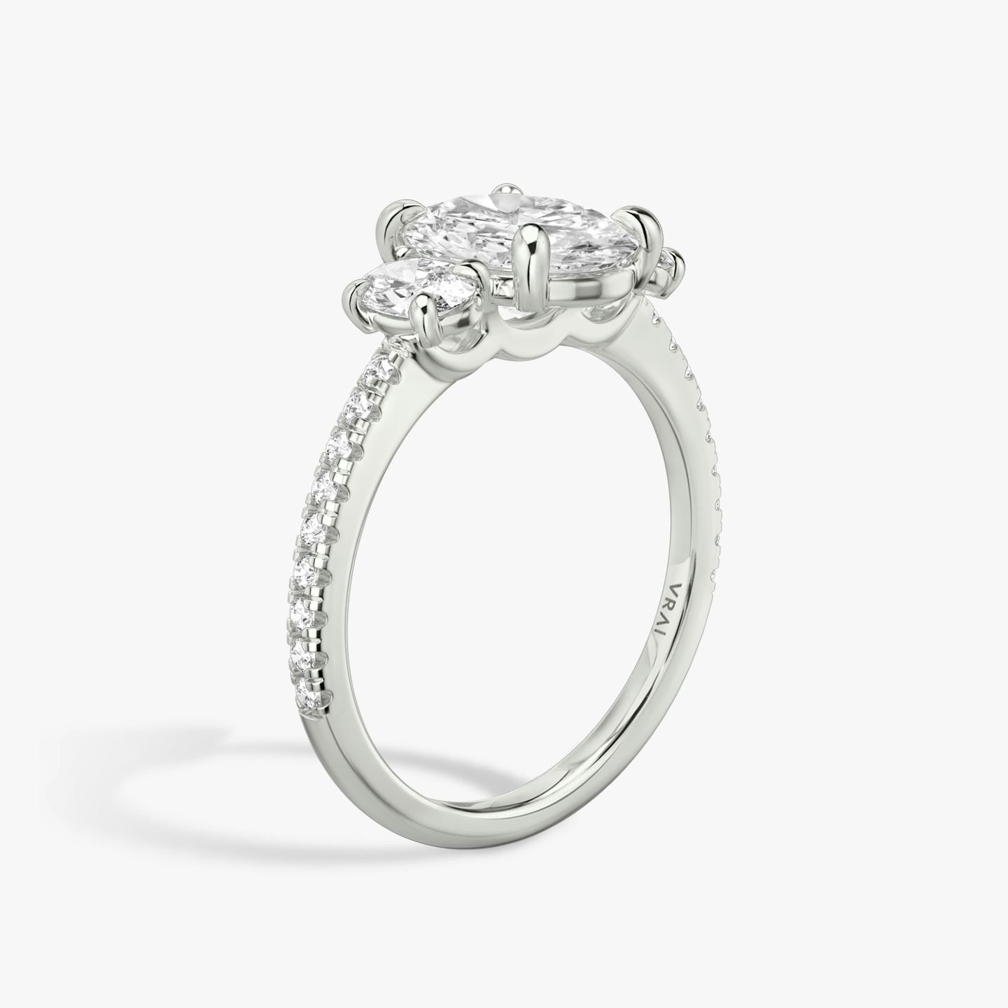 The Three Stone | Oval | Platinum | Band: Pavé | Side stone carat: 1/4 | Side stone shape: Oval | Diamond orientation: vertical | Carat weight: See full inventory