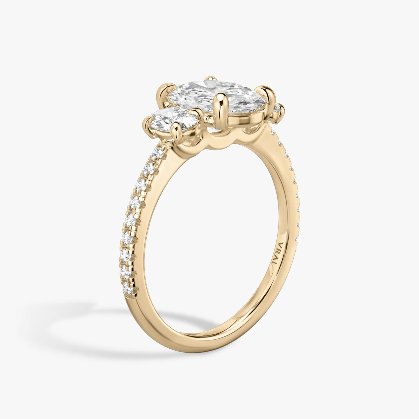 The Three Stone | Oval | 14k | 14k Rose Gold | Band: Pavé | Side stone carat: 1/4 | Side stone shape: Oval | Diamond orientation: vertical | Carat weight: See full inventory