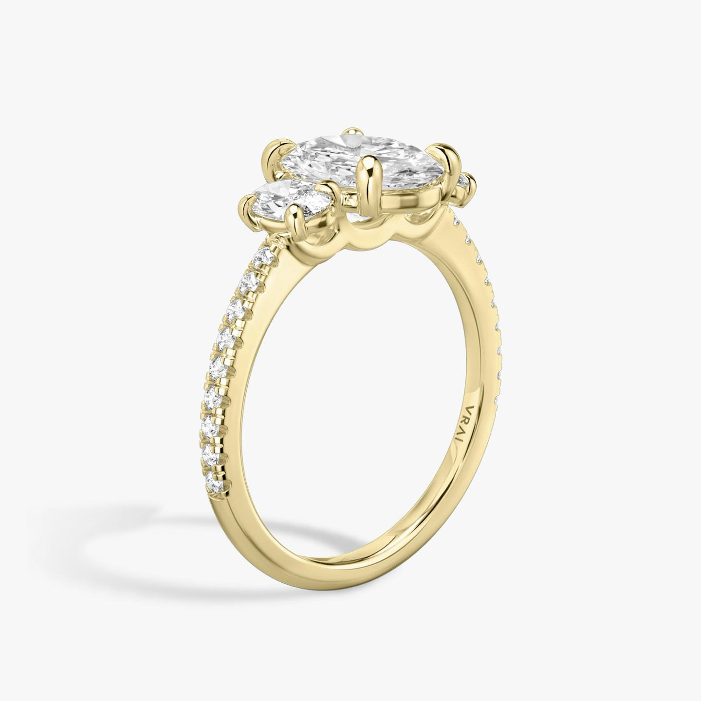 The Three Stone | Oval | 18k | 18k Yellow Gold | Band: Pavé | Side stone carat: 1/4 | Side stone shape: Oval | Diamond orientation: vertical | Carat weight: See full inventory