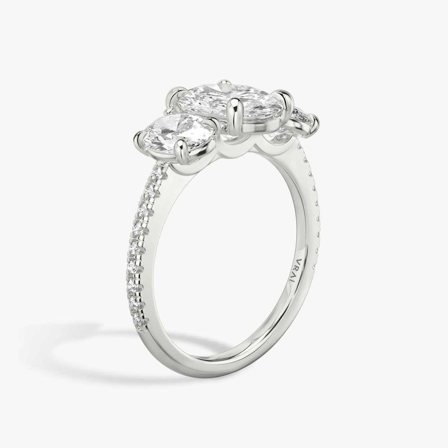 The Three Stone | Oval | Platinum | Band: Pavé | Side stone carat: 1/2 | Side stone shape: Oval | Diamond orientation: vertical | Carat weight: See full inventory