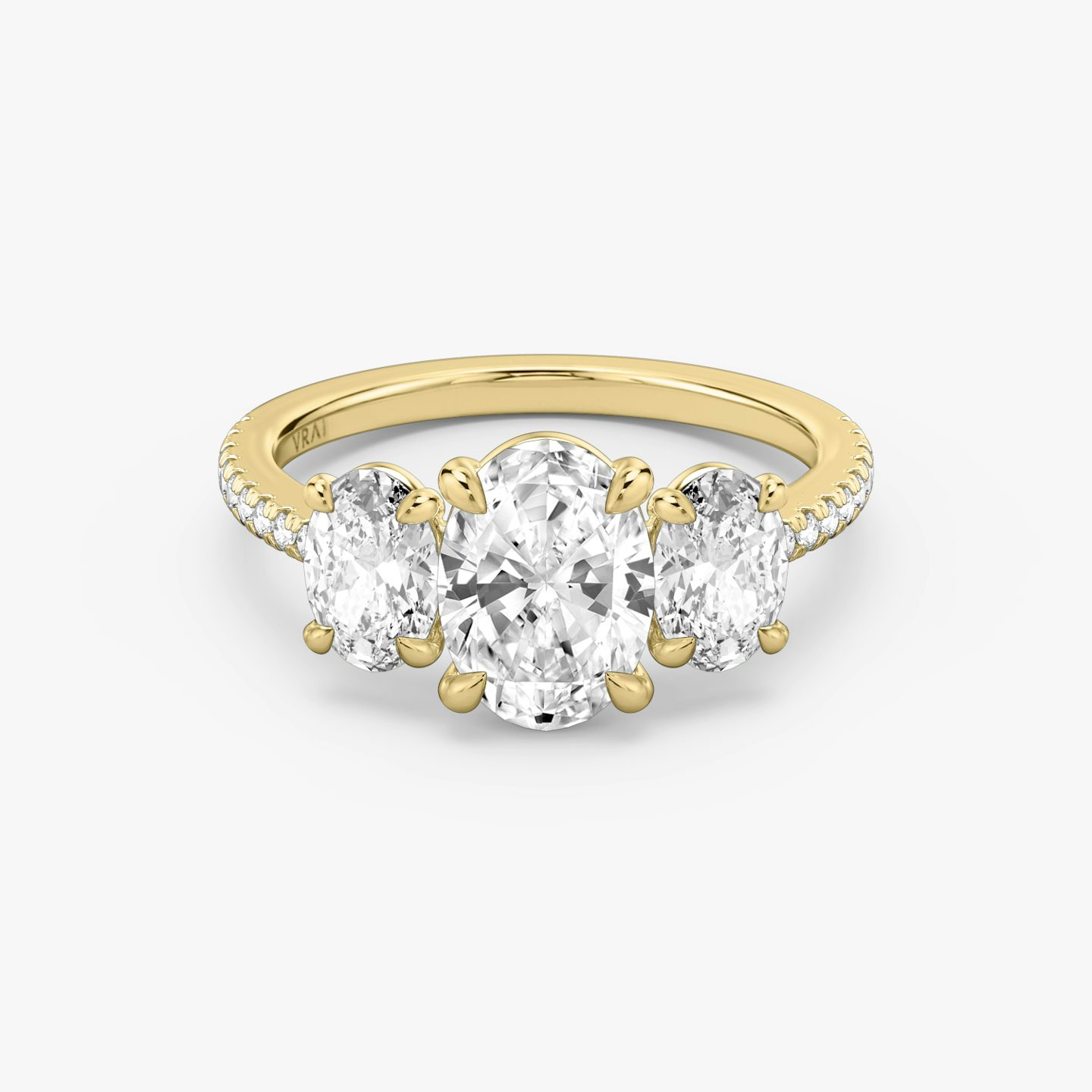 The Three Stone | Oval | 18k | 18k Yellow Gold | Band: Pavé | Side stone carat: 1/2 | Side stone shape: Oval | Diamond orientation: vertical | Carat weight: See full inventory