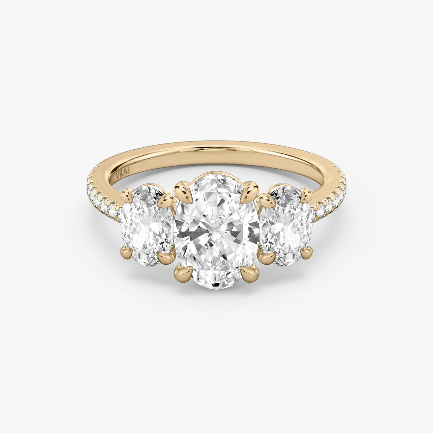 The Three Stone | Oval | 14k | 14k Rose Gold | Band: Pavé | Side stone carat: 1/2 | Side stone shape: Oval | Diamond orientation: vertical | Carat weight: See full inventory