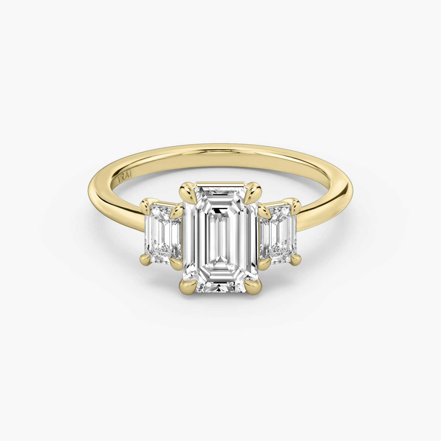 emerald cut diamond engagement ring with yellow band