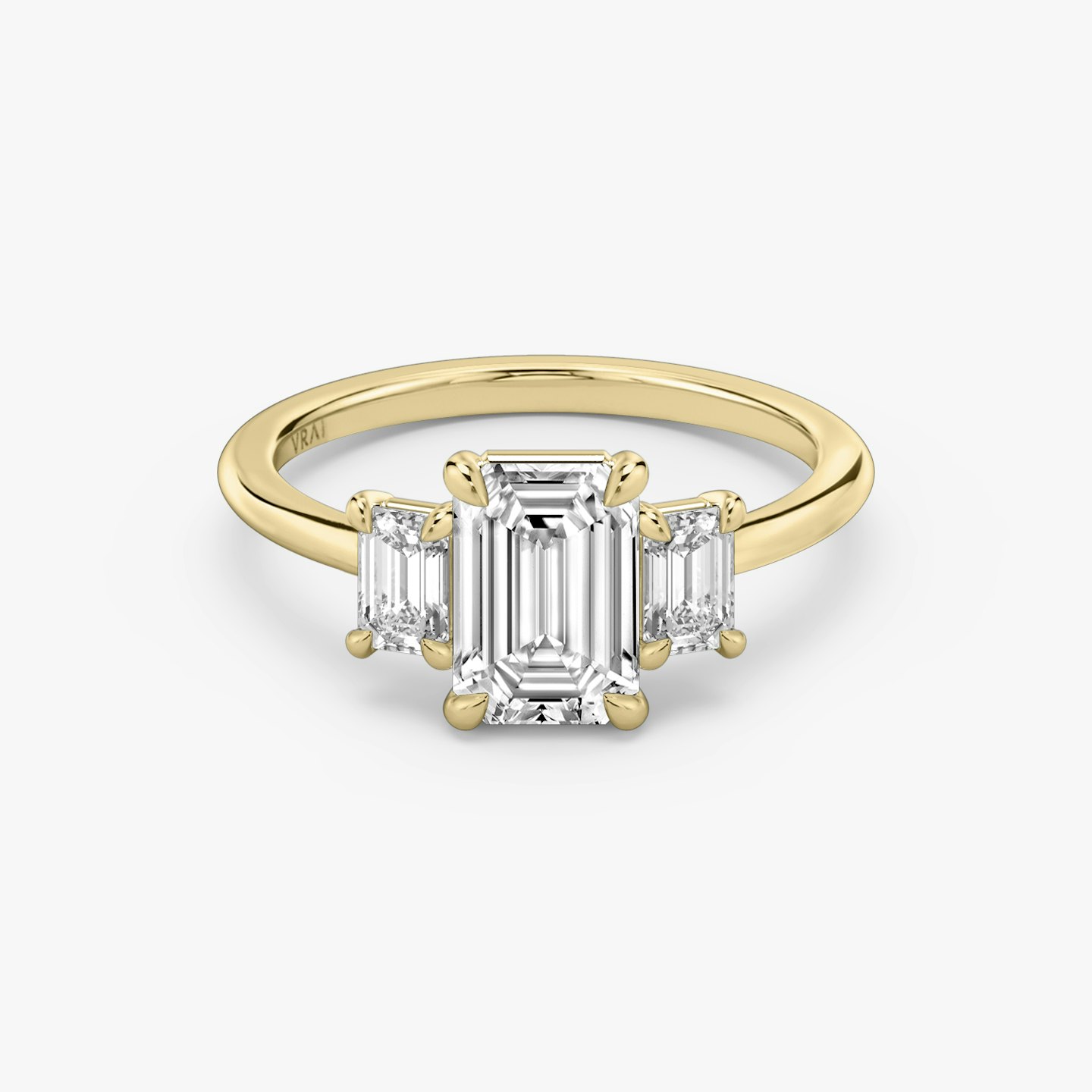 emerald cut diamond engagement ring with yellow band