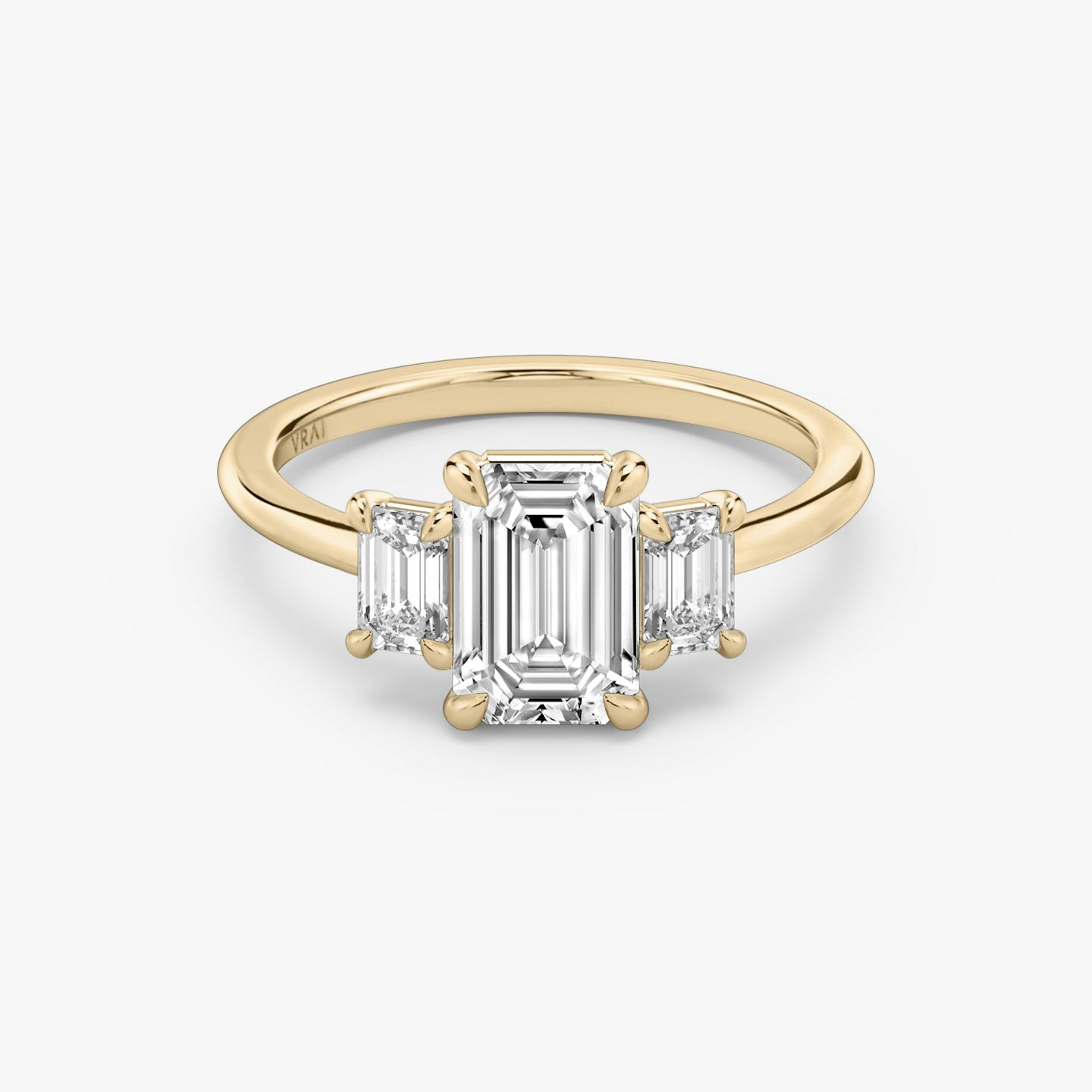 The Three Stone | Emerald | 14k | 14k Rose Gold | Band: Plain | Side stone carat: 1/4 | Side stone shape: Emerald | Diamond orientation: vertical | Carat weight: See full inventory