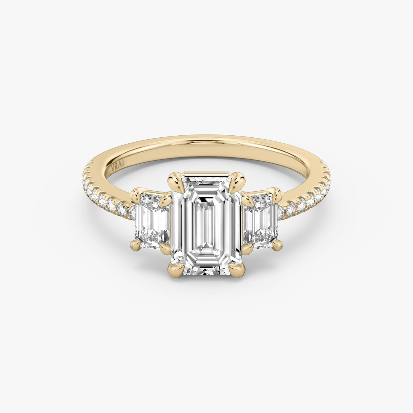 The Three Stone | Emerald | 14k | 14k Rose Gold | Band: Pavé | Side stone carat: 1/4 | Side stone shape: Emerald | Diamond orientation: vertical | Carat weight: See full inventory