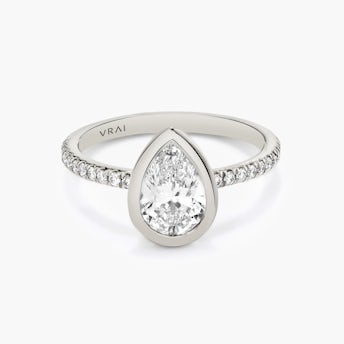 Platinum Signature Bezel engagement ring with Pear cut diamond