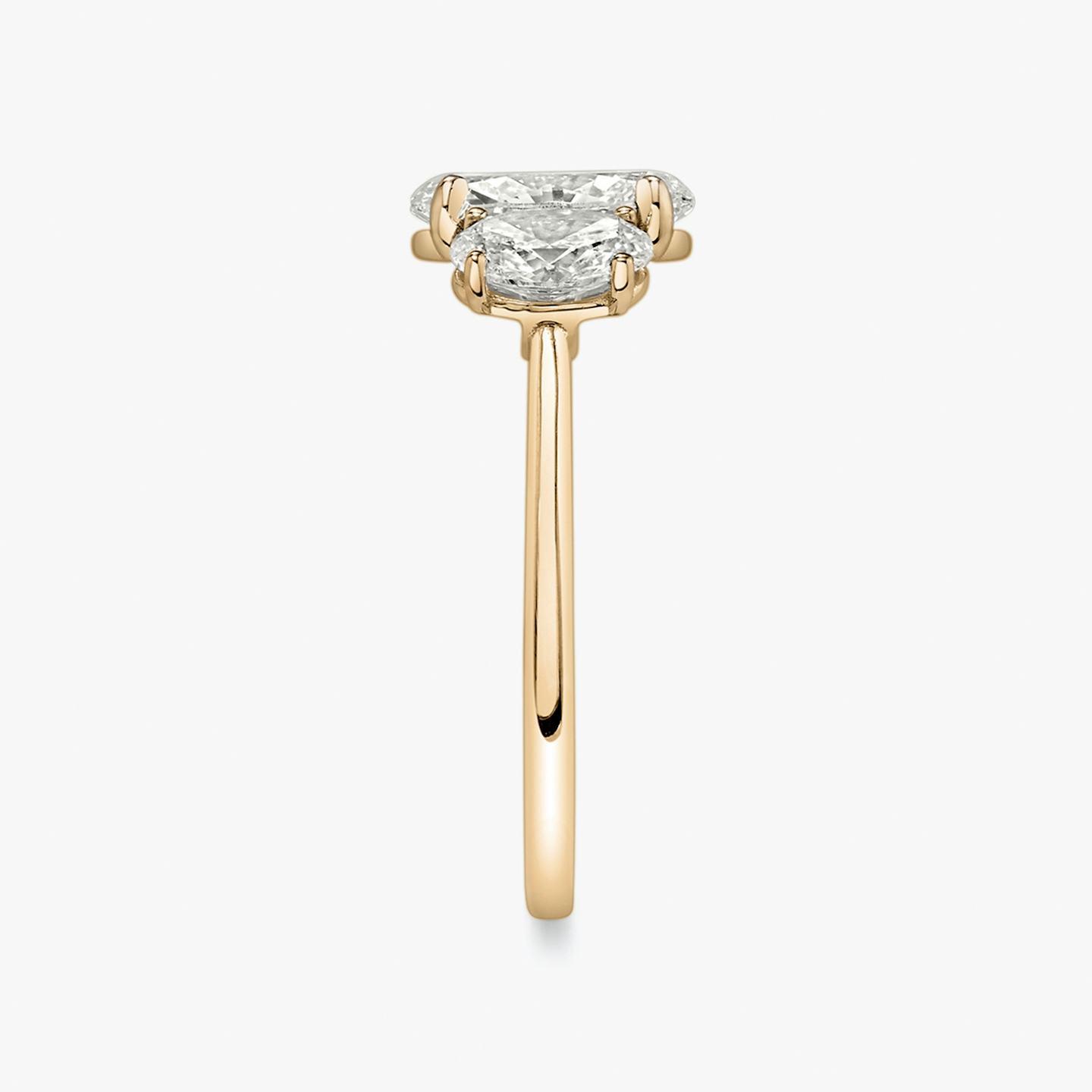The Three Stone | Oval | 14k | 14k Rose Gold | Band: Plain | Side stone carat: 1/2 | Side stone shape: Oval | Diamond orientation: vertical | Carat weight: See full inventory