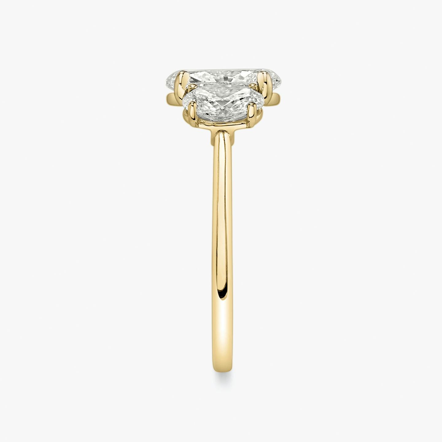 The Three Stone | Oval | 18k | 18k Yellow Gold | Band: Plain | Side stone carat: 1/2 | Side stone shape: Oval | Diamond orientation: vertical | Carat weight: See full inventory