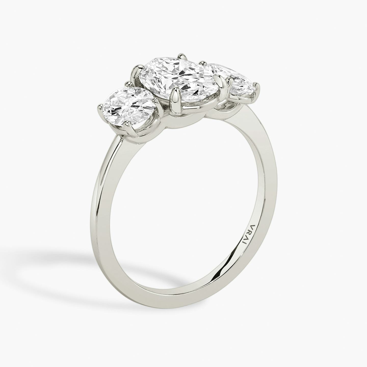 The Three Stone | Oval | 18k | 18k White Gold | Band: Plain | Side stone carat: 1/2 | Side stone shape: Oval | Diamond orientation: vertical | Carat weight: See full inventory