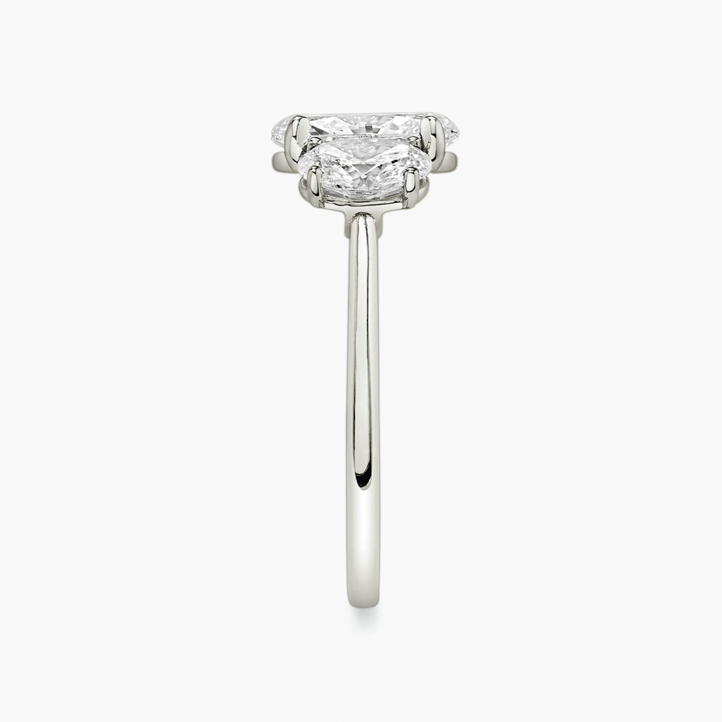 The Three Stone | Oval | Platinum | Band: Plain | Side stone carat: 1/2 | Side stone shape: Oval | Diamond orientation: vertical | Carat weight: See full inventory