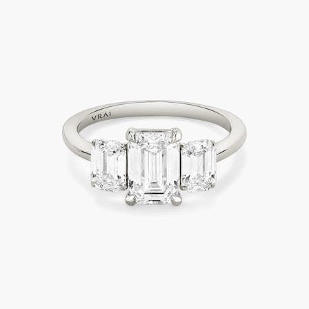 platinum three stone emerald engagement ring