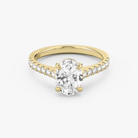 Yellow gold Cathedral engagement ring with Oval cut diamond
