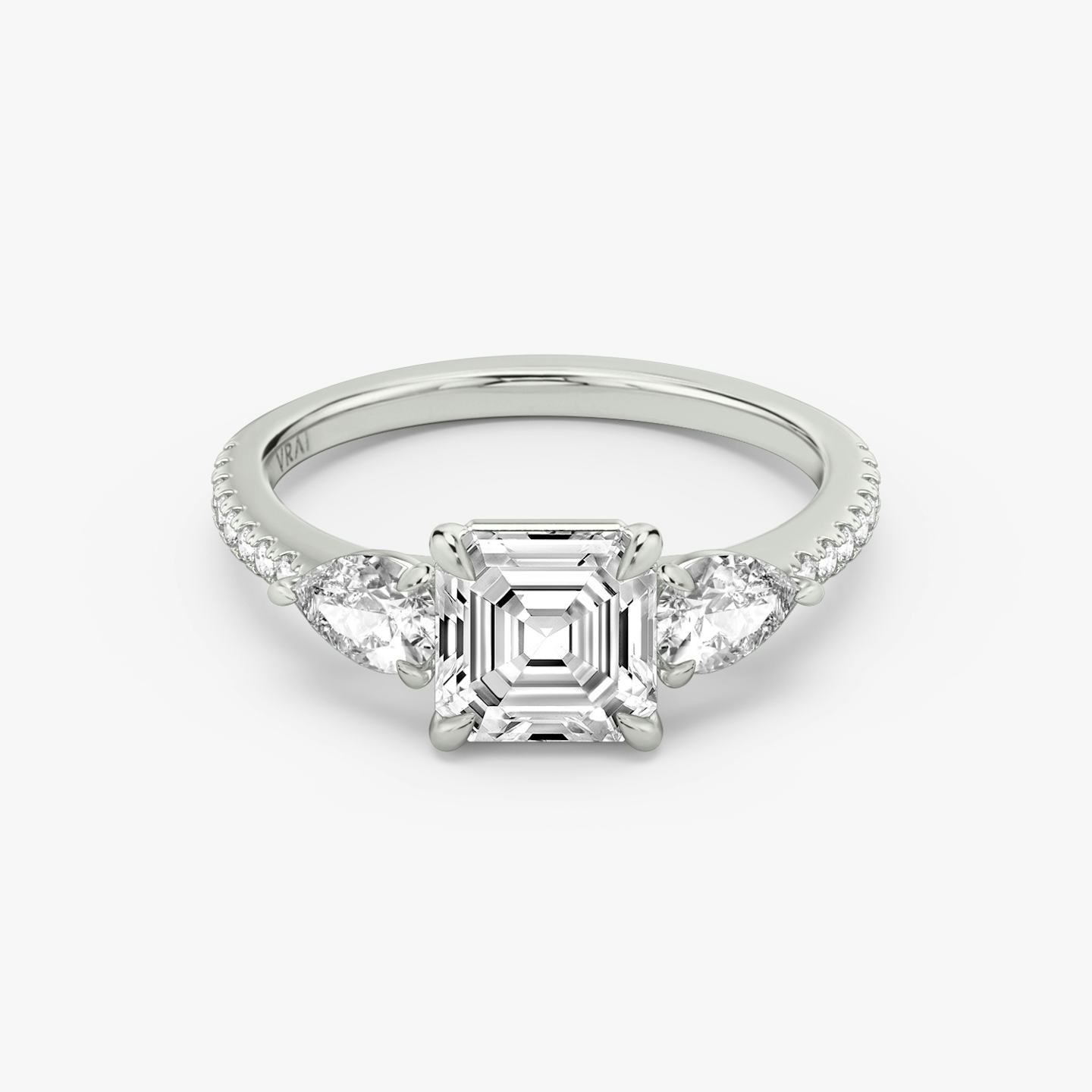 The Three Stone | Asscher | Platinum | Band: Pavé | Side stone carat: 1/4 | Side stone shape: Pear | Diamond orientation: vertical | Carat weight: See full inventory