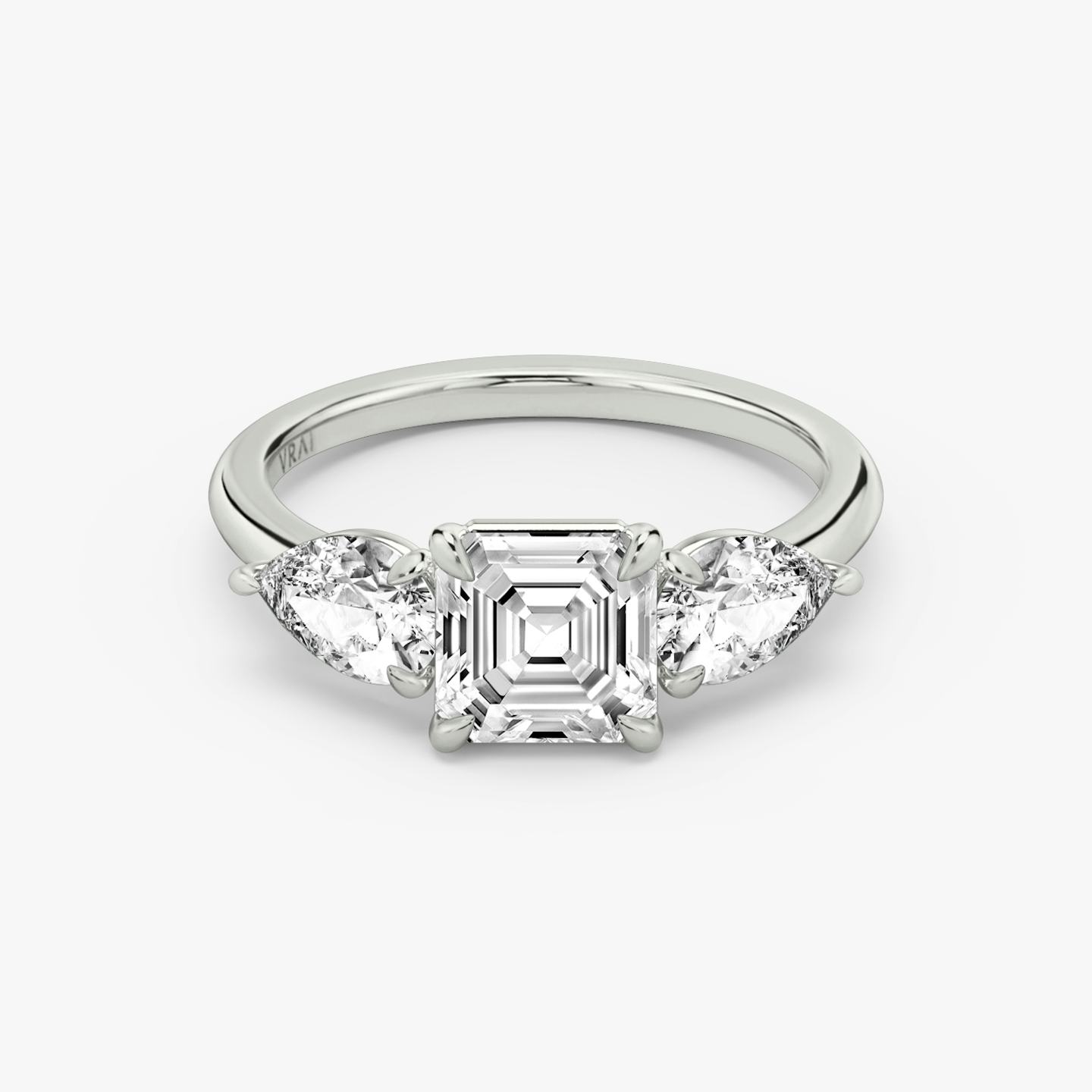 The Three Stone | Asscher | Platinum | Band: Plain | Side stone carat: 1/2 | Side stone shape: Pear | Diamond orientation: vertical | Carat weight: See full inventory