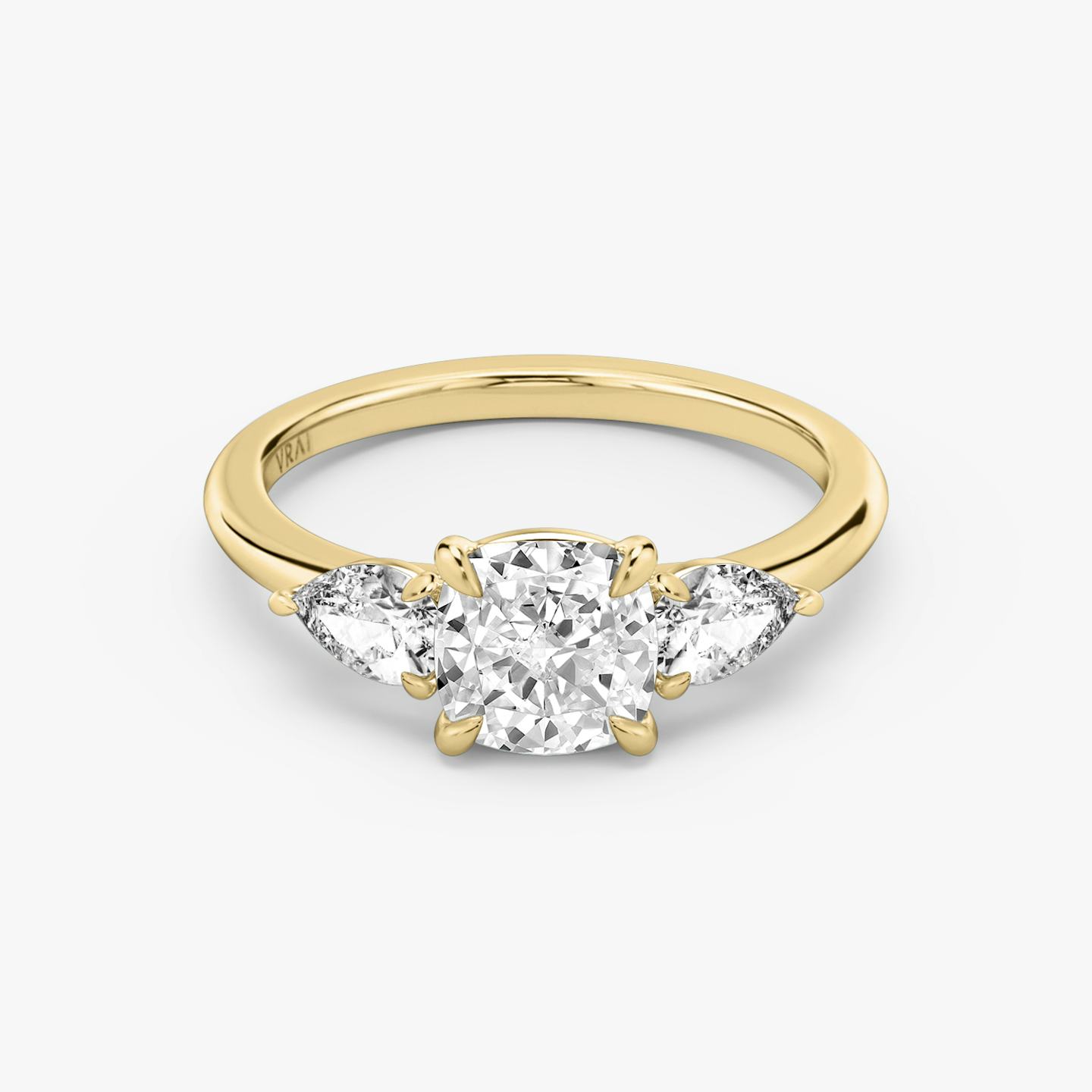 The Three Stone | Pavé Cushion | 18k | 18k Yellow Gold | Band: Plain | Side stone carat: 1/4 | Side stone shape: Pear | Diamond orientation: vertical | Carat weight: See full inventory