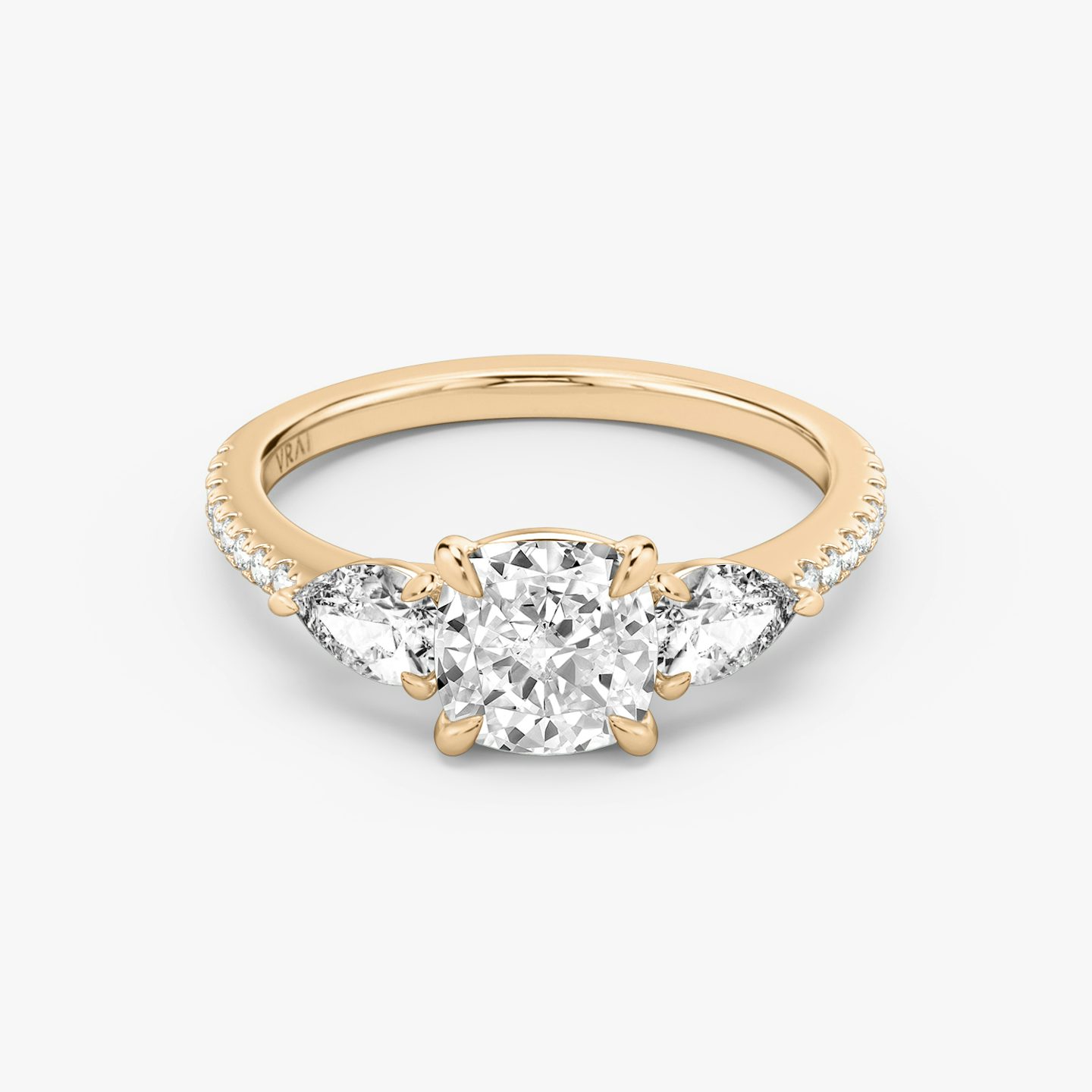 The Three Stone | Pavé Cushion | 14k | 14k Rose Gold | Band: Pavé | Side stone carat: 1/4 | Side stone shape: Pear | Diamond orientation: vertical | Carat weight: See full inventory