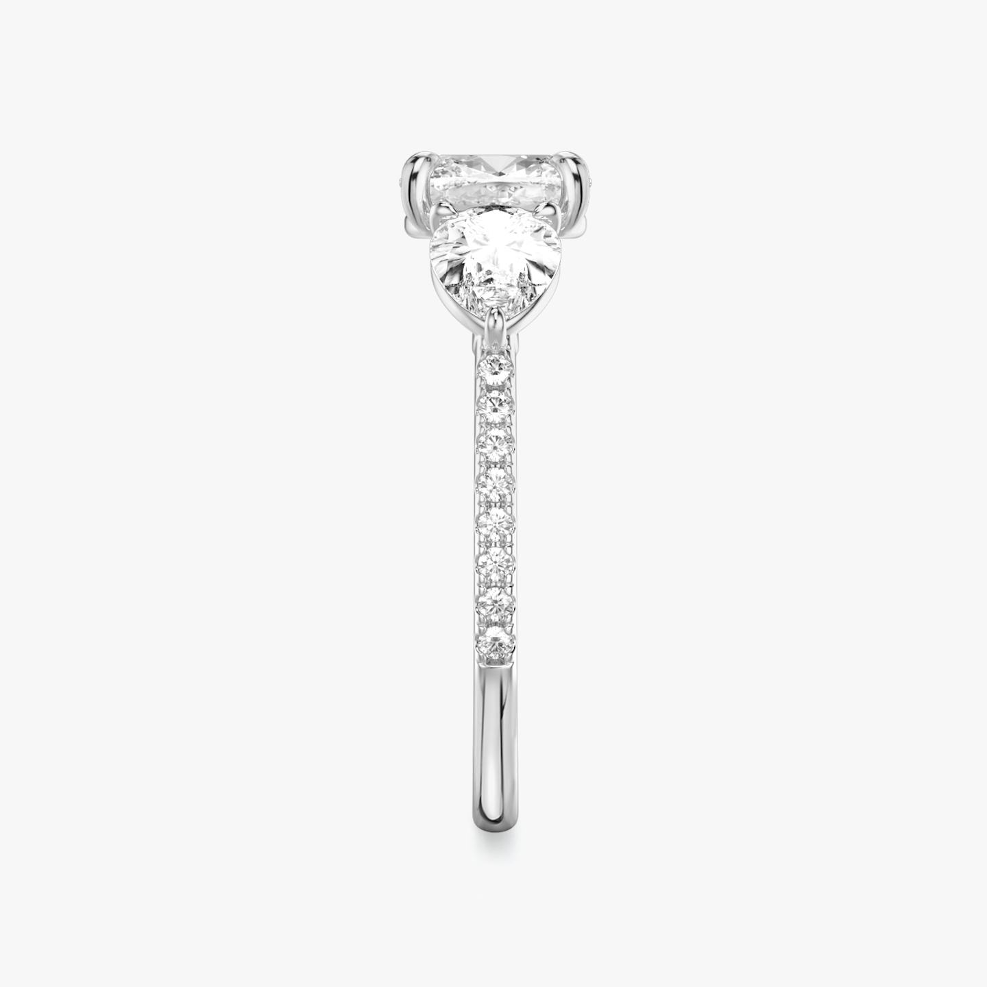 The Three Stone | Pavé Cushion | Platinum | Band: Pavé | Side stone carat: 1/2 | Side stone shape: Pear | Diamond orientation: vertical | Carat weight: See full inventory