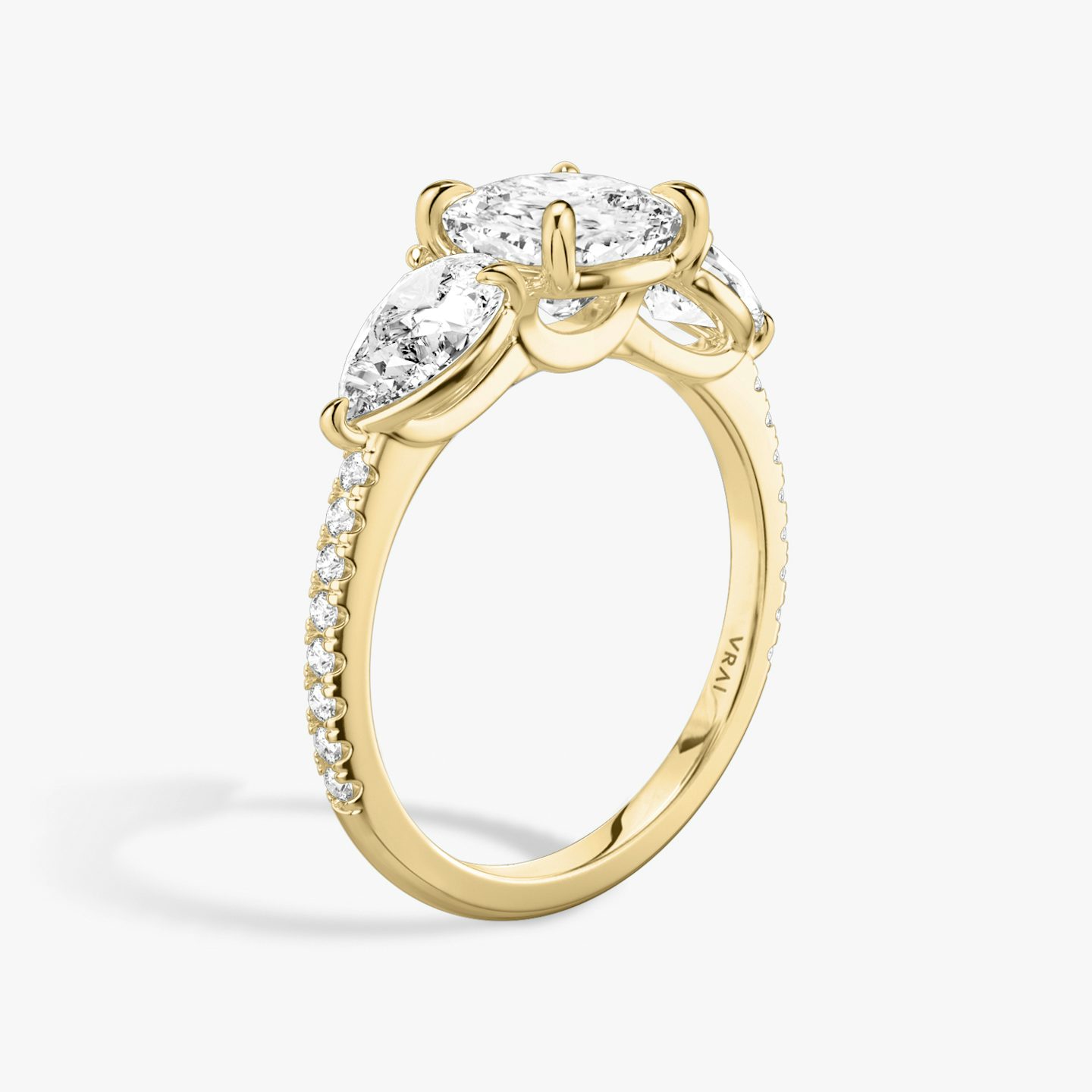 The Three Stone | Pavé Cushion | 18k | 18k Yellow Gold | Band: Pavé | Side stone carat: 1/2 | Side stone shape: Pear | Diamond orientation: vertical | Carat weight: See full inventory