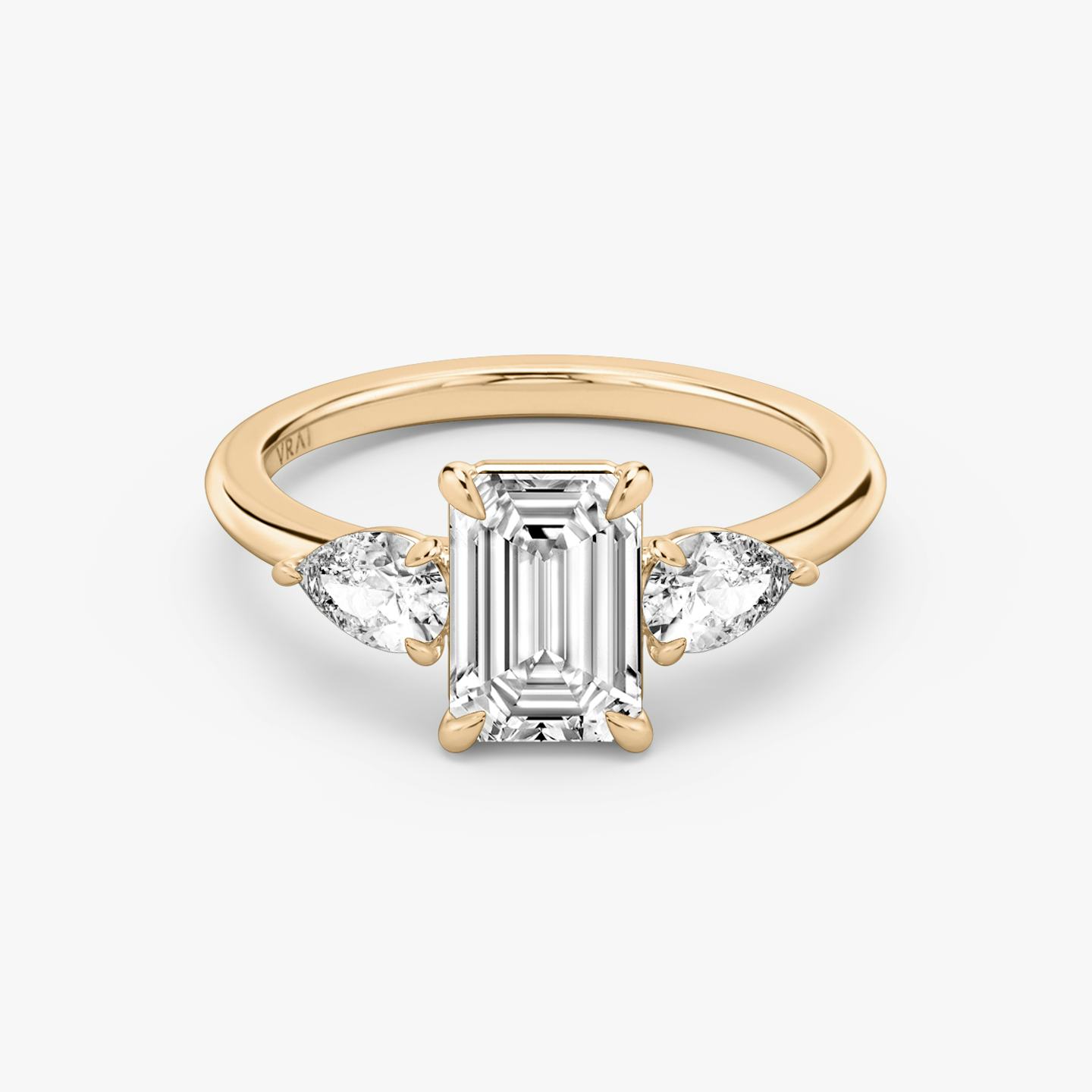 The Three Stone | Emerald | 14k | 14k Rose Gold | Band: Plain | Side stone carat: 1/4 | Side stone shape: Pear | Diamond orientation: vertical | Carat weight: See full inventory