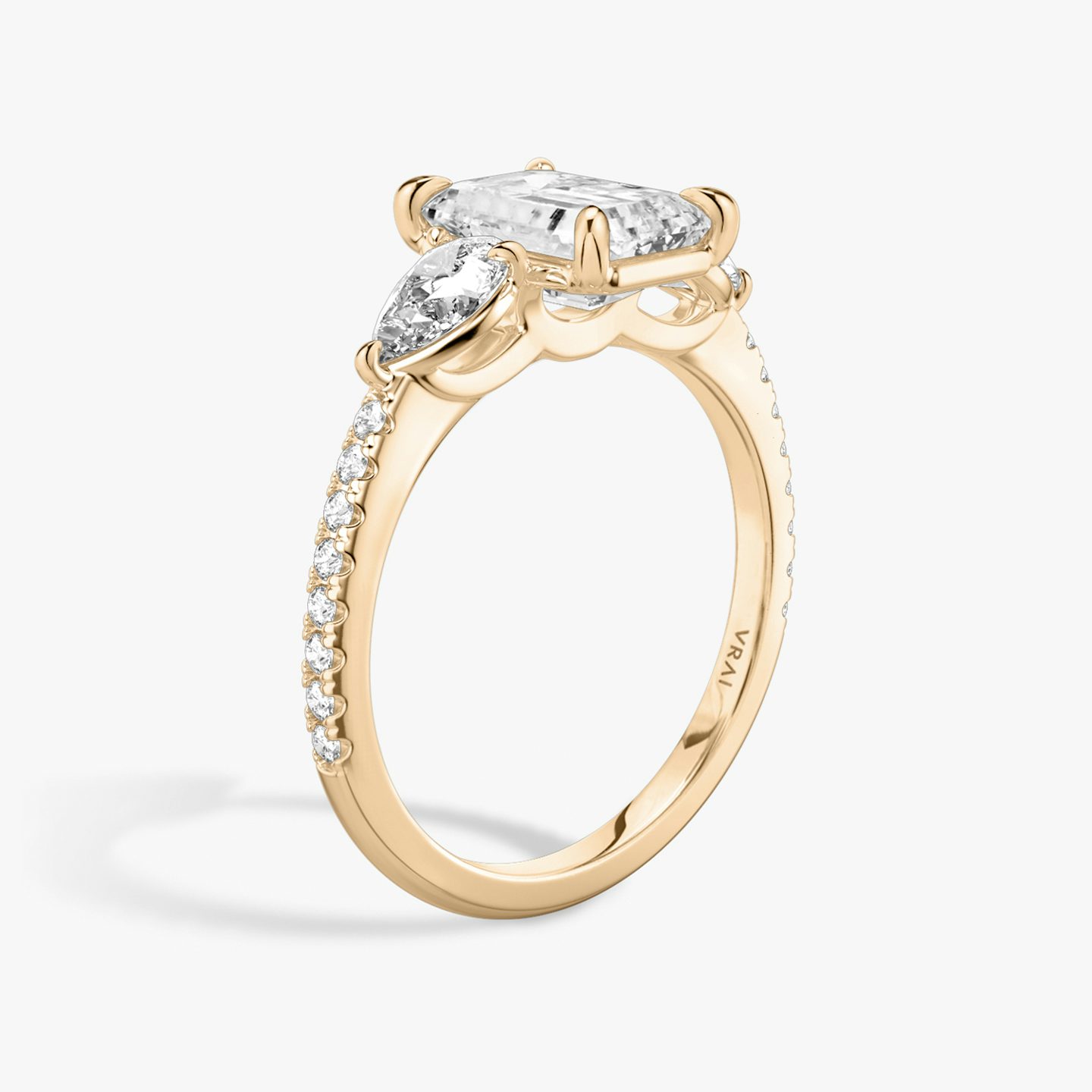 The Three Stone | Emerald | 14k | 14k Rose Gold | Band: Pavé | Side stone carat: 1/4 | Side stone shape: Pear | Diamond orientation: vertical | Carat weight: See full inventory