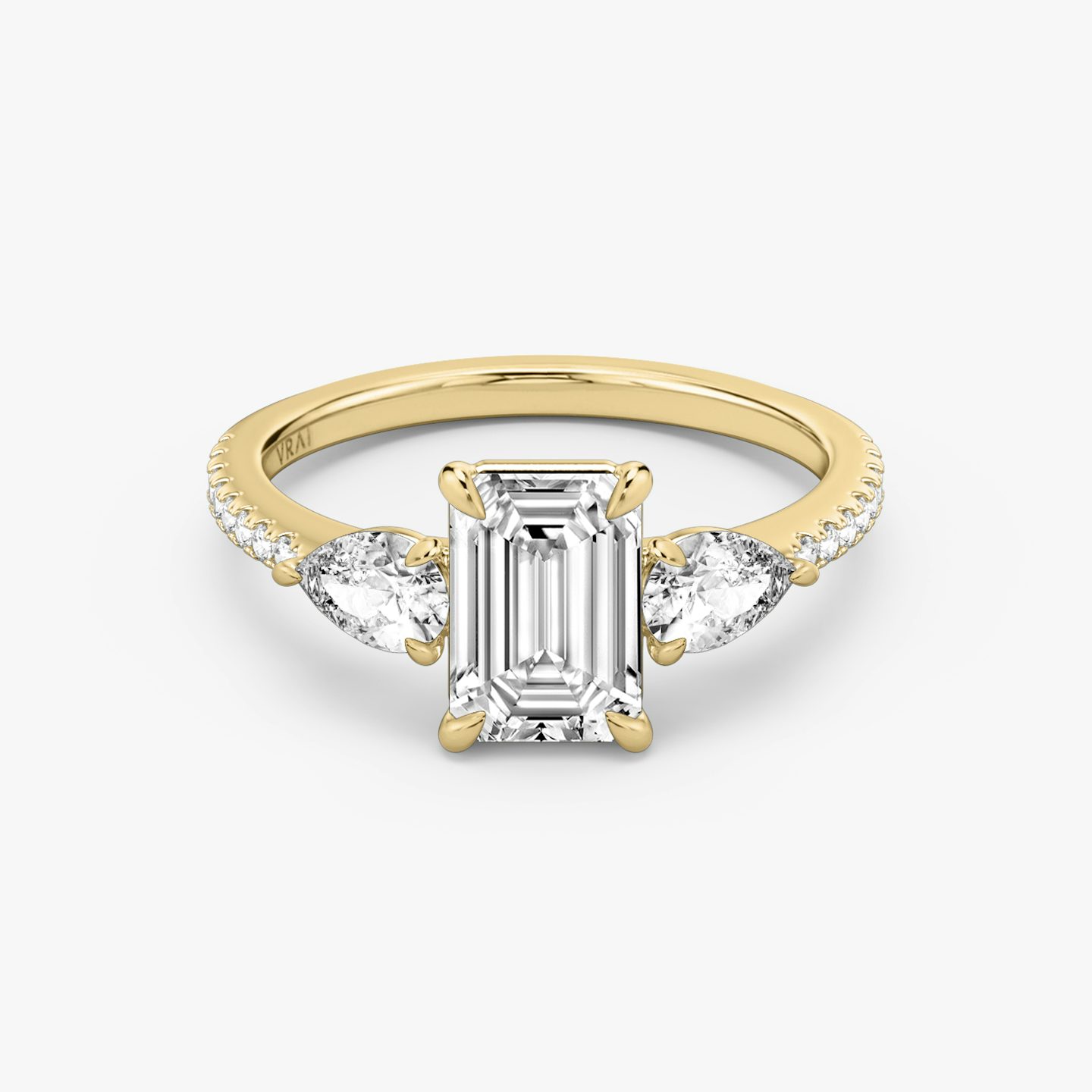 The Three Stone | Emerald | 18k | 18k Yellow Gold | Band: Pavé | Side stone carat: 1/4 | Side stone shape: Pear | Diamond orientation: vertical | Carat weight: See full inventory